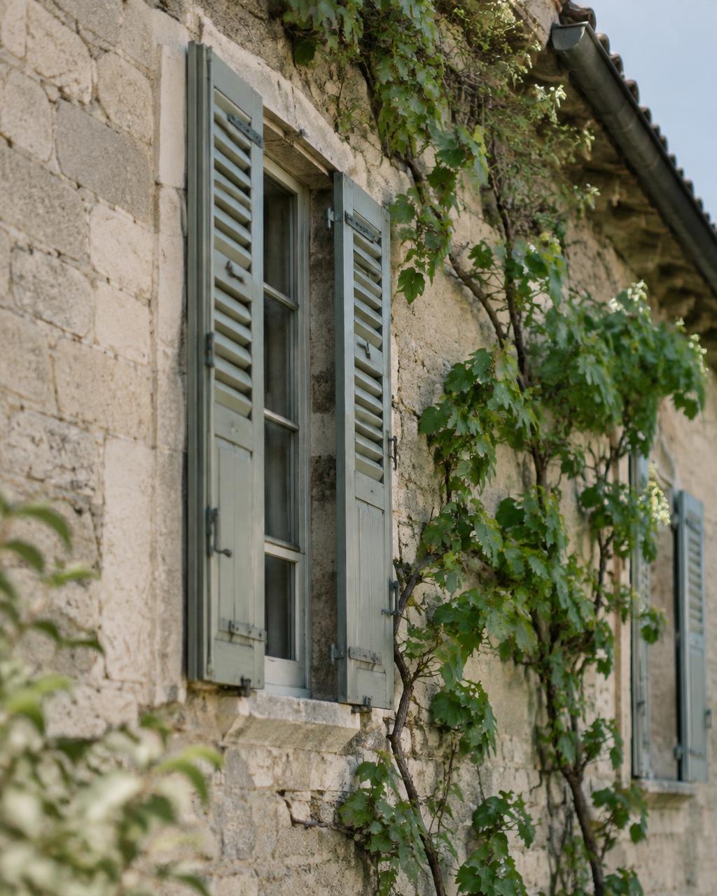 Limestone walls and old shutters of the house